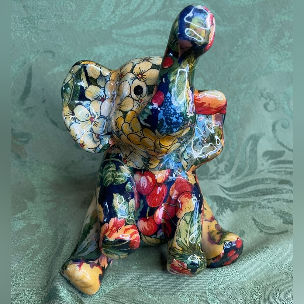 Collectible elephant trunk up for good luck. Vintage La Vie Safari, collage.
